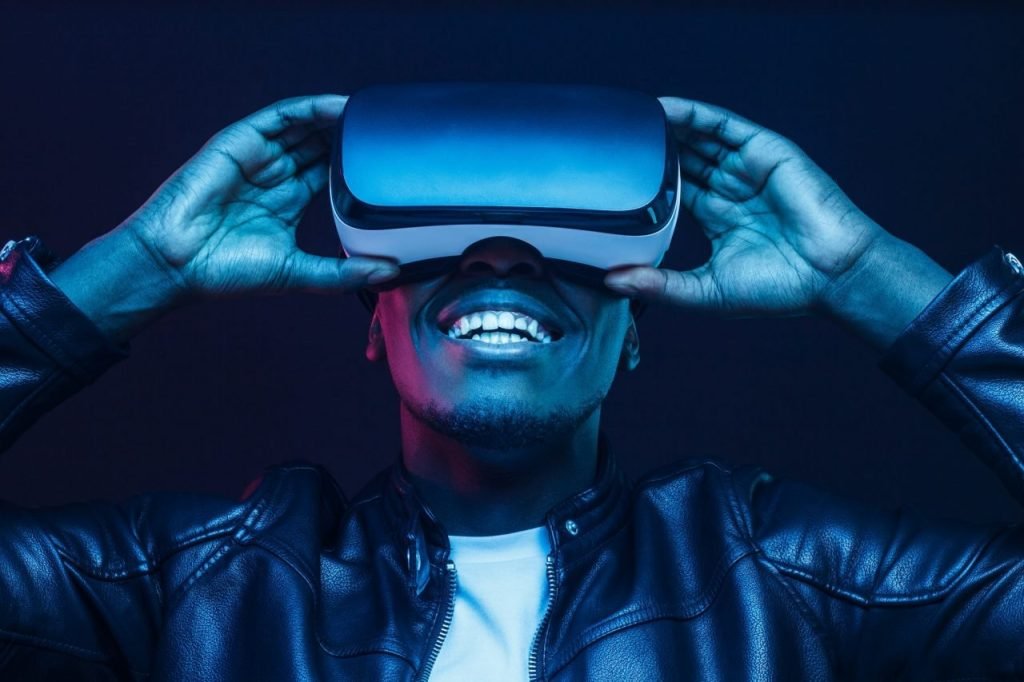 african-man-wearing-virtual-reality-headset-having-great-fun african-man-wearing-virtual-reality-headset-having-great-fun
